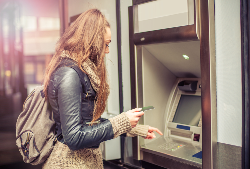 international student in australia withdrawing money from atm